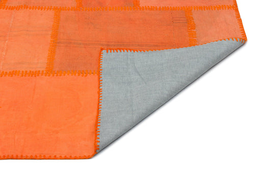 Teselya Orange Patchwork Wool Handmade Area Rug 6'5" x 9'9"