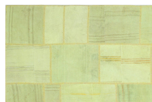 Teselya Green Patchwork Wool Handmade Area Rug 6'7" x 9'11"