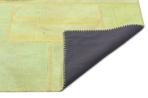 Teselya Green Patchwork Wool Handmade Area Rug 6'6" x 9'11"