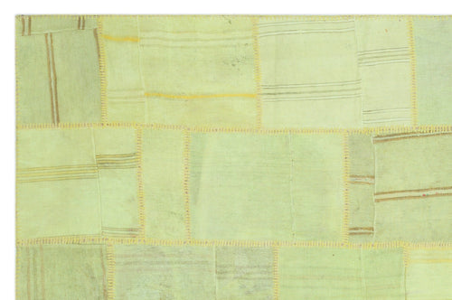 Teselya Green Patchwork Wool Handmade Area Rug 6'6" x 9'11"