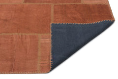 Teselya Orange Patchwork Wool Handmade Area Rug 6'5" x 9'9"