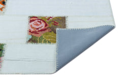 Teselya White Floral Wool Handmade Area Rug 4'0" x 5'11"