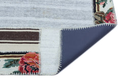 Teselya Red Floral Wool Handmade Area Rug 5'0" x 7'1"