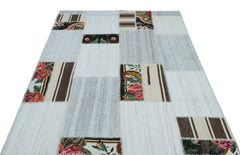 Teselya Red Floral Wool Handmade Area Rug 5'0" x 7'1"