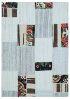 Teselya Red Floral Wool Handmade Area Rug 5'0" x 7'1"