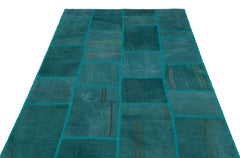 Teselya Turquoise Patchwork Wool Handmade Area Rug 4'11" x 7'5"