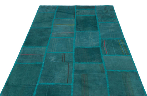 Teselya Turquoise Patchwork Wool Handmade Area Rug 4'11" x 7'5"