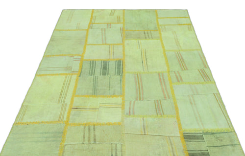Teselya Green Patchwork Wool Handmade Area Rug 5'1" x 7'7"