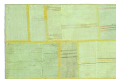 Teselya Green Patchwork Wool Handmade Area Rug 5'1" x 7'7"
