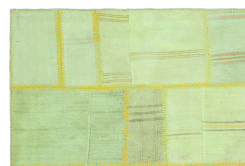Teselya Green Patchwork Wool Handmade Area Rug 5'1" x 7'7"