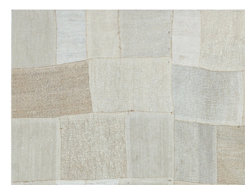 Teselya Beige Patchwork Wool Handmade Area Rug 4'11" x 6'8"