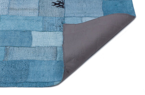 Teselya Turquoise Patchwork Wool Handmade Area Rug 5'3" x 7'4"