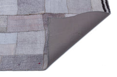 Teselya Purple Patchwork Wool Handmade Area Rug 5'7" x 7'10"