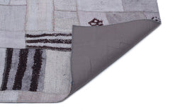 Teselya Purple Patchwork Wool Handmade Area Rug 5'3" x 7'7"