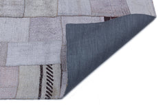 Teselya Purple Patchwork Wool Handmade Area Rug 5'7" x 7'10"