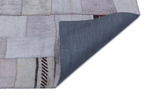 Teselya Purple Patchwork Wool Handmade Area Rug 5'7" x 7'10"