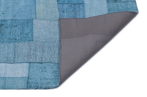 Teselya Turquoise Patchwork Wool Handmade Area Rug 5'3" x 7'5"