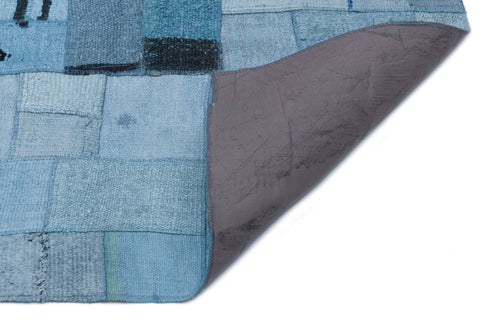 Teselya Turquoise Patchwork Wool Handmade Area Rug 5'3" x 7'5"