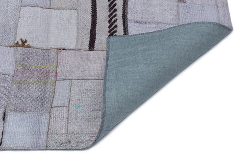 Teselya Purple Patchwork Wool Handmade Area Rug 5'3" x 7'4"