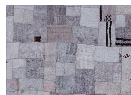 Teselya Purple Patchwork Wool Handmade Area Rug 5'3" x 7'4"