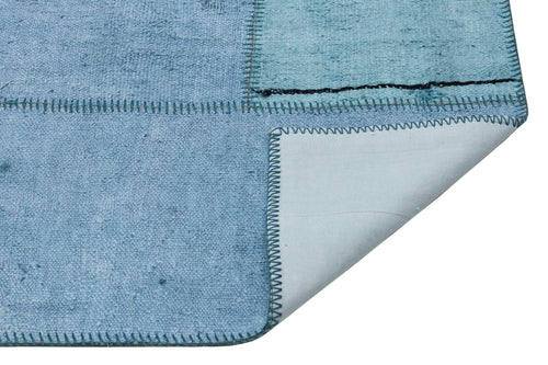 Teselya Turquoise Patchwork Wool Handmade Area Rug 5'1" x 7'4"