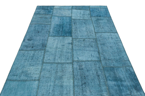 Teselya Turquoise Patchwork Wool Handmade Area Rug 5'1" x 6'11"
