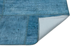 Teselya Purple Patchwork Wool Handmade Area Rug 5'1" x 7'5"