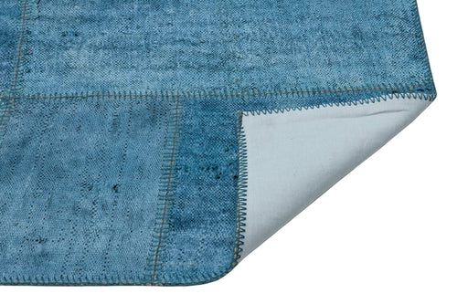 Teselya Purple Patchwork Wool Handmade Area Rug 5'1" x 7'5"