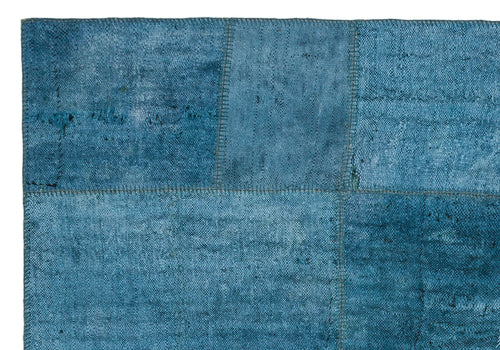 Teselya Purple Patchwork Wool Handmade Area Rug 5'1" x 7'5"