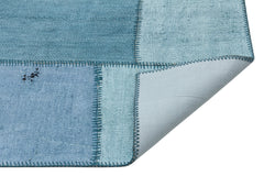 Teselya Turquoise Patchwork Wool Handmade Area Rug 5'1" x 7'4"