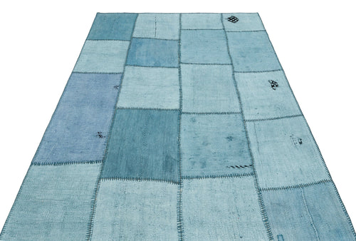 Teselya Turquoise Patchwork Wool Handmade Area Rug 5'1" x 7'4"