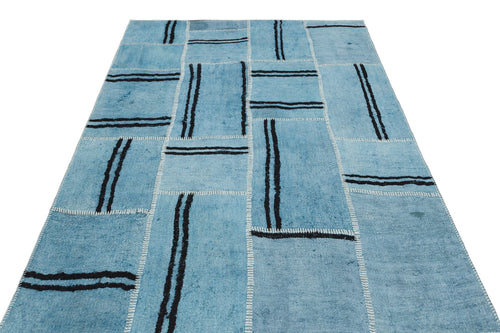 Teselya Turquoise Patchwork Wool Handmade Area Rug 5'3" x 7'1"