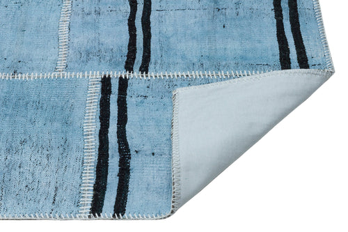 Teselya Turquoise Patchwork Wool Handmade Area Rug 5'2" x 7'6"