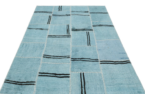 Teselya Turquoise Patchwork Wool Handmade Area Rug 5'3" x 6'10"