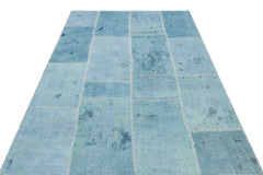 Teselya Turquoise Patchwork Wool Handmade Area Rug 5'2" x 7'6"
