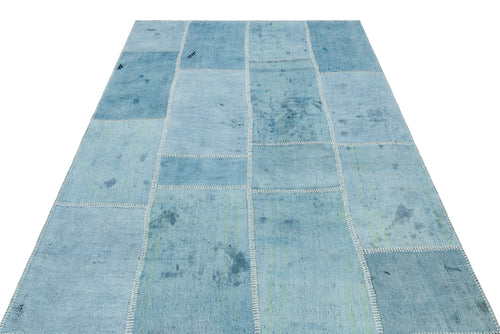 Teselya Turquoise Patchwork Wool Handmade Area Rug 5'2" x 7'6"